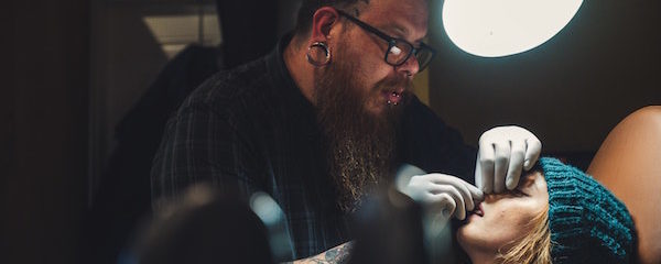 girl gets nose pierced