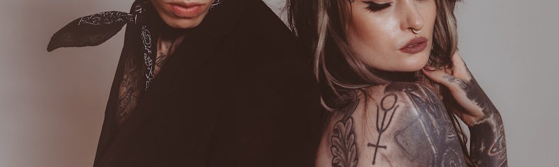 Two Pierced and Tattooed People
