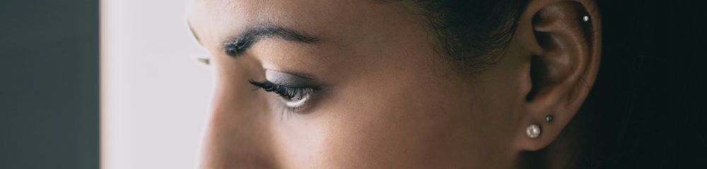woman with multiple ear piercings