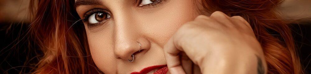 woman with septum and nostril piercing