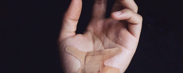 close up of palm with band aid