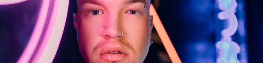 Person with multiple facial piercings