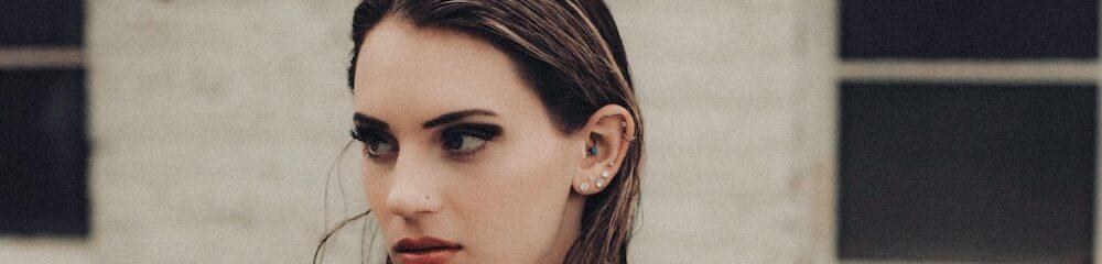 Woman with multiple ear piercings