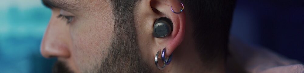 Man with helix earring and two lobe piercings