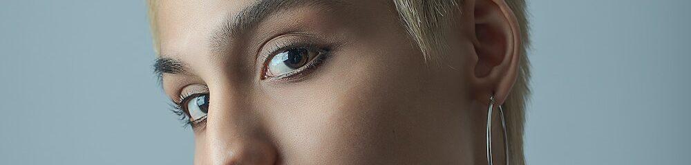 Woman with septum, ear, and Ashley piercings