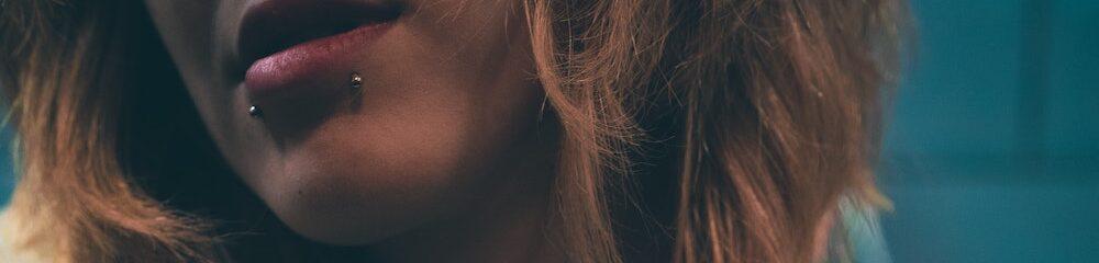 Woman with two side labret piercings
