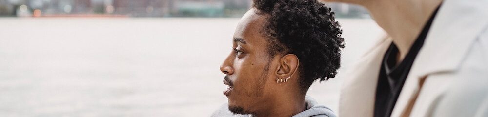 Man with multiple lobe piercings