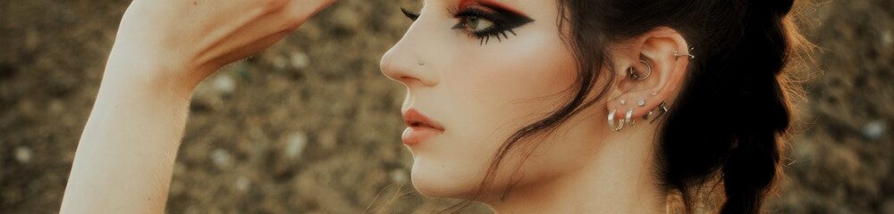 Woman with daith piercing and other ear piercings