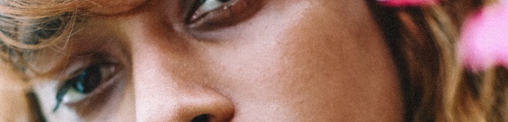 Woman with nostril and septum piercings