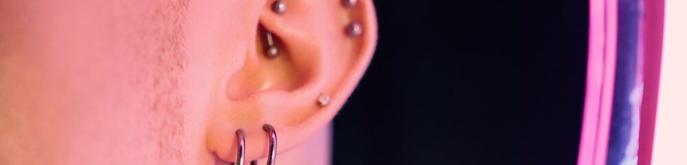 Man with lobe piercings