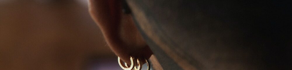 Man with multiple lobe piercings