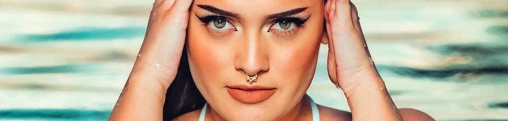 Woman in pool with septum piercing