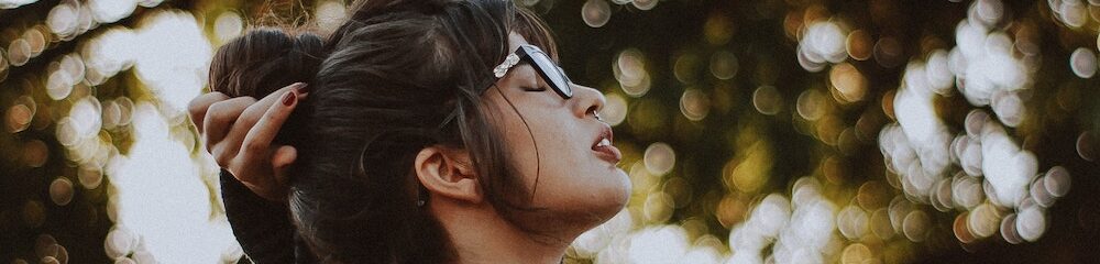 Woman posing in a sunny forest