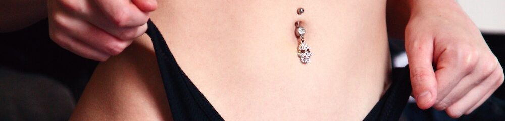 Woman with belly button piercing