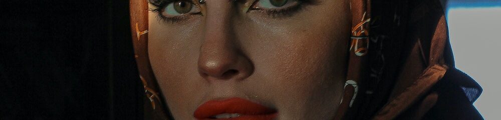 Woman with bridge piercing and cool makeup