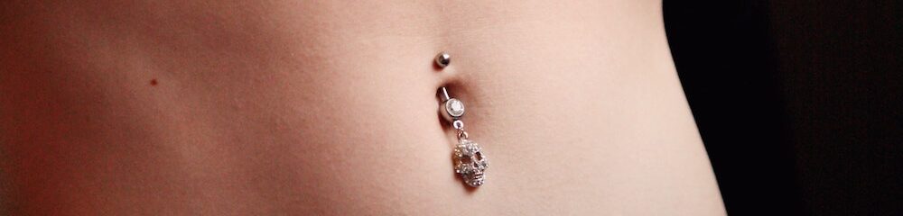 Woman showing off navel piercing