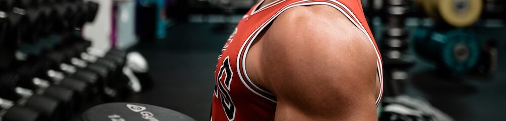 Man with an earring exercising