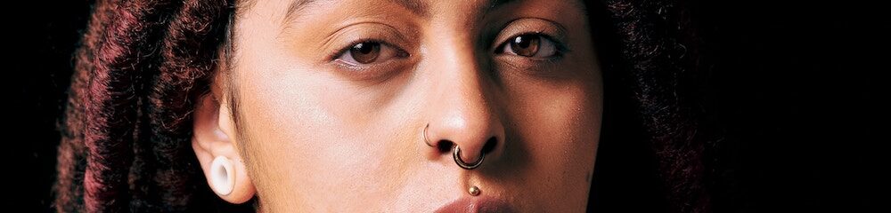 Woman with philtrum piercing