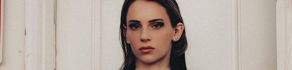 Woman with multiple cartilage piercings